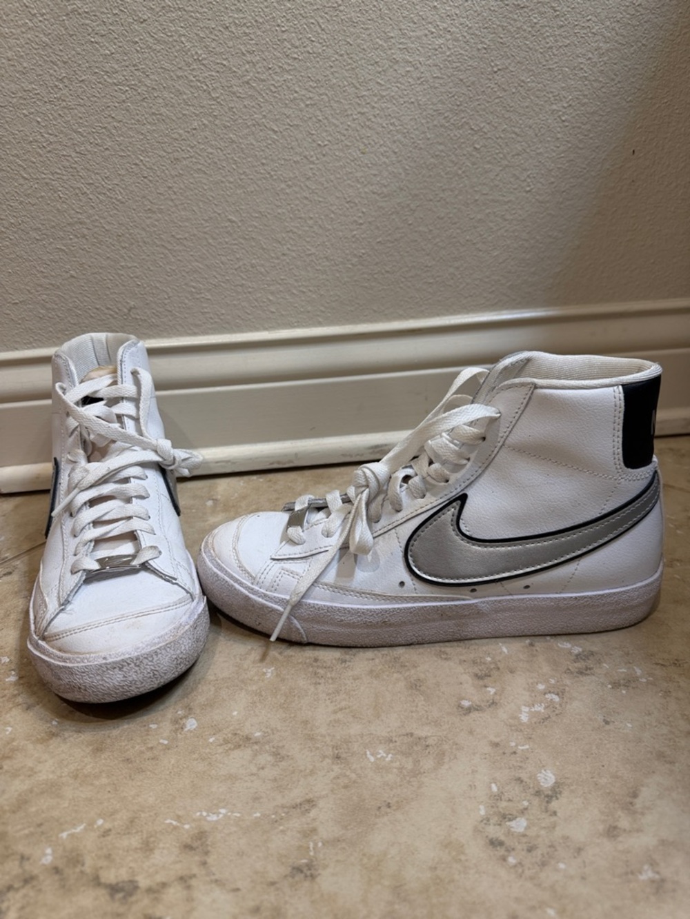 Nike White High-Top Sneakers with Silver Swoosh